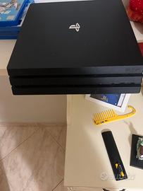 ps 4 pro1T + volante+ giochi