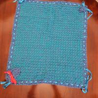 Copertina per neonato bicolore in lana