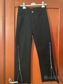 Jeans flared con zip