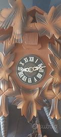 orologio cucu' con una catena scarrucolato