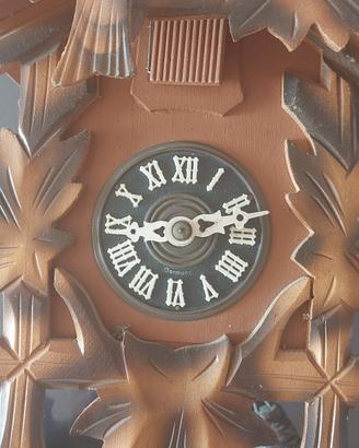 orologio cucu' con una catena scarrucolato