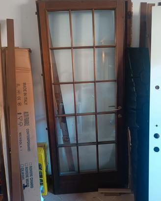 Porta in legno massello +grata in ferro con telaio