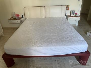 letto matrimoniale con testata in pelle