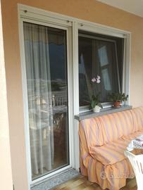 Porta e finestra in PVC accoppiate Finstral