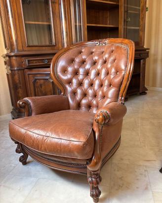 Coppia di poltrone capitonné in pelle cognac