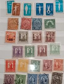 Album con francobolli di Cina e Giappone