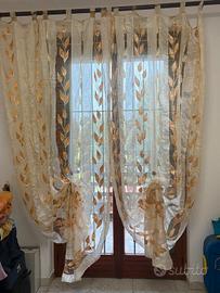 Coppia tende eleganti velate con foglie oro e pass