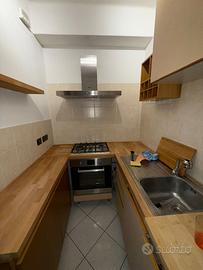 Cucina Snaidero con ripiani in legno massiccio