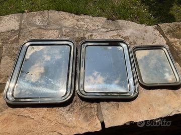 tre vassoi in metallo lucidato Hacker