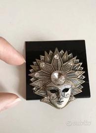 Venetian mask brooch in metal