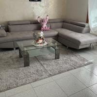 Divano con penisola e parete attrezzata