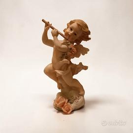 putto che suona il flauto