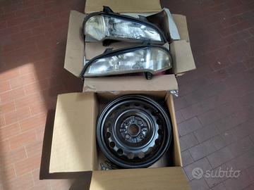 Toyota cerchi 14 x5 e Opel Tigra fari completi