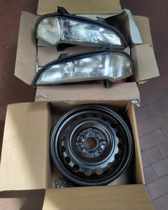 Toyota cerchi 14 x5 e Opel Tigra fari completi