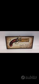 quadro pistola 