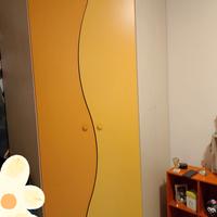 Armadio ad angolo e letto