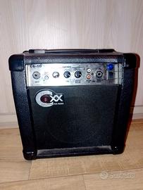 Amplificatore per chitarra elettrica e tracolla 