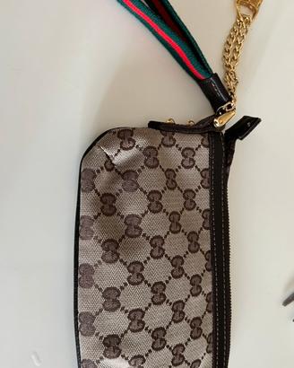 Pochette  con cerniera  Gucci non originale