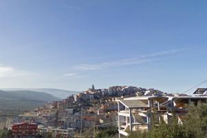 Fabbricato 4 piani e terreno circostante