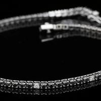 TENNIS BRACCIALE ORO 18KT BRILLANTI NERI E BIANCHI