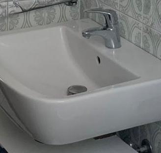 Lavabo Dolomite con miscelatore hasgrohe