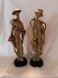 Coppia statue orientali vintage in resina decorata