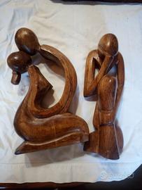 coppia di sculture in legno massello intagliate a 