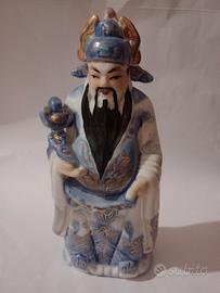 statuina giapponese in ceramica.