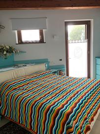 Coperta matrimoniale in lana lavorata all’unci