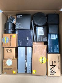 Confezioni, scatole e custodie di ottiche Nikon