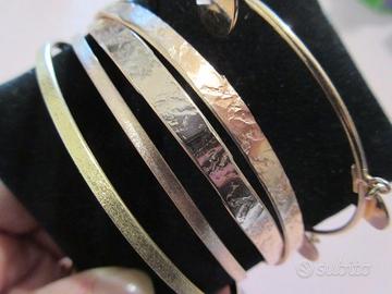 5 Bracciali in argento dorato