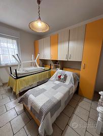 Cameretta con armadio a ponte due letti singoli