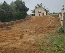 Terreno con casa