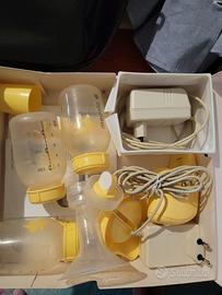 tiralatte medela + 3 contenitori e 2 trasformatori