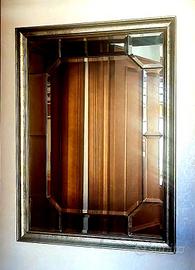 Specchio con cornice color oro