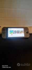 Nintendo Switch 1 V2 + borsa e gioco Sports