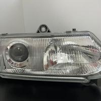 NUOVO & orig. faro principale HELLA per ALFA ROMEO