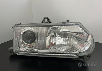 NUOVO & orig. faro principale HELLA per ALFA ROMEO