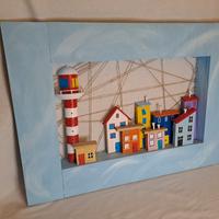 Borgo di mare con casette colorate e faro