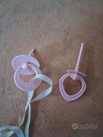 bambole, ciucci, biberon etc