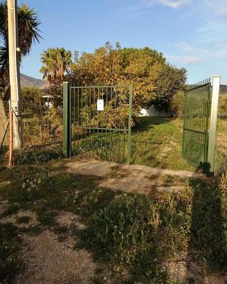 Terreno con casa