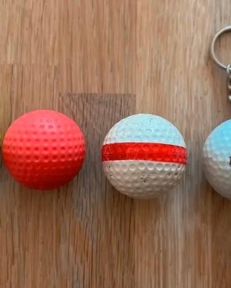 4 Palline da golf. 1 è un portachiavi