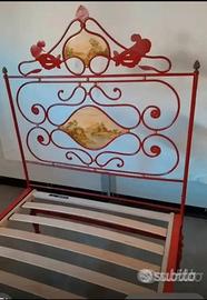 Letto decorato in ferro battuto