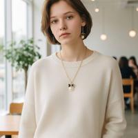 Set collana + orecchini fiocco nero e perla