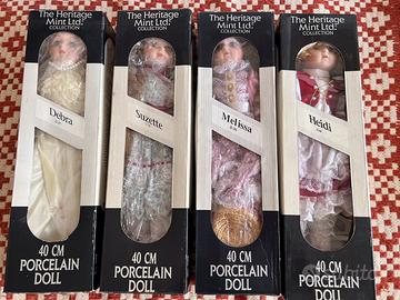 4 bambole in porcellana nuove