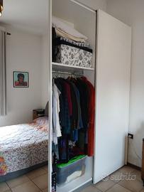 Armadio, letto matrimoniale e comodini