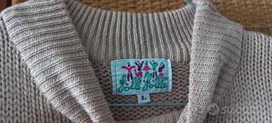 maglione rosa con ricami di fiori e foglie