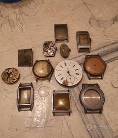 Lotto ingranaggi e casse di orologi molto vecchi