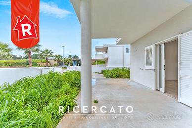 Piano terra bifamiliare con giardino