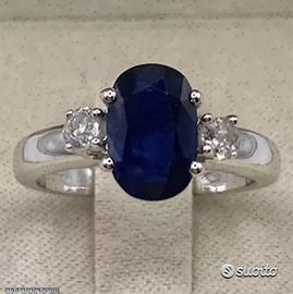 ANELLO ORO 18kt. CON DIAMANTI E ZAFFIRO BLU OVALE